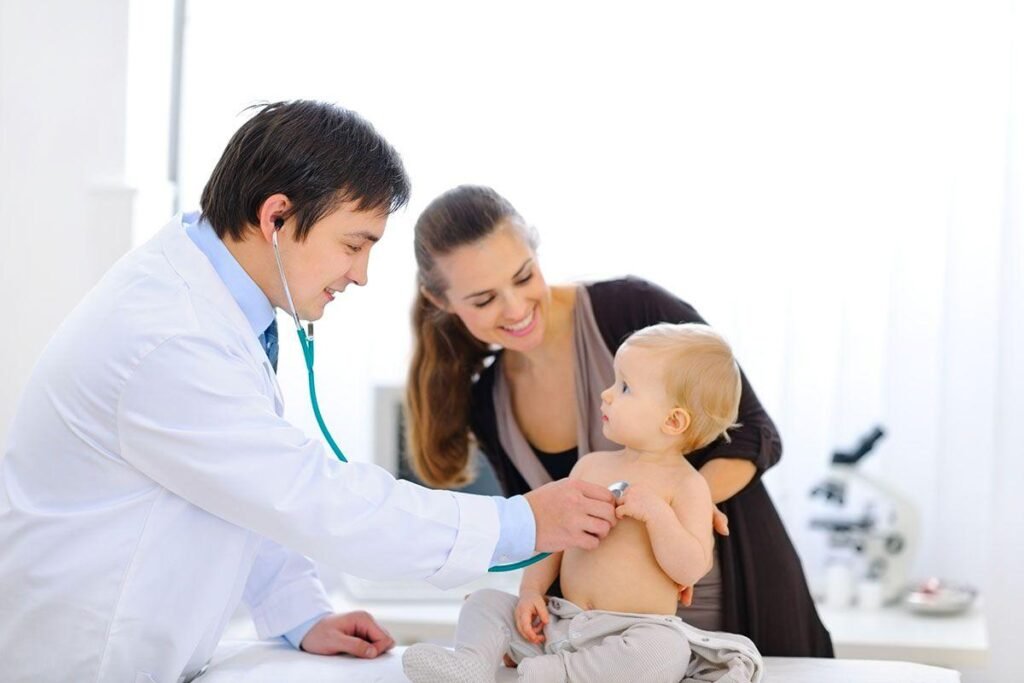 Pediatrician interacting with a child while parents look on at Shafiq Children Clinic in Lahore